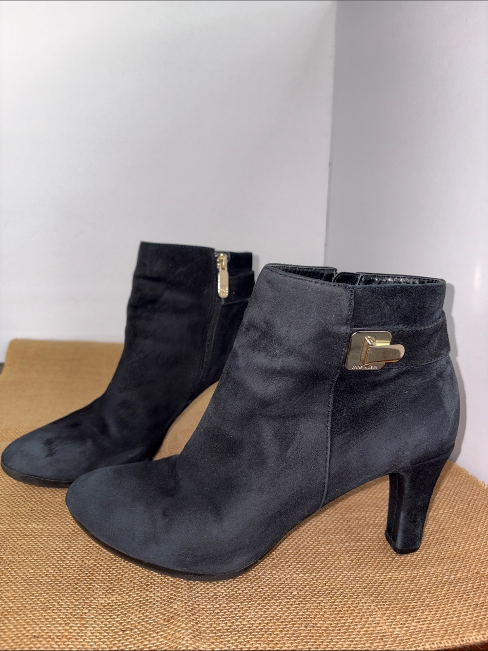 Anne Klein Black Suede Ankle Heeled Boots with Gold Logo Accent